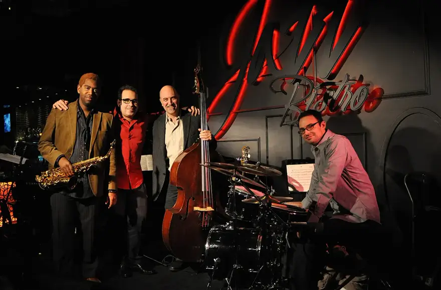A Latin jazz quartet on a club stage
